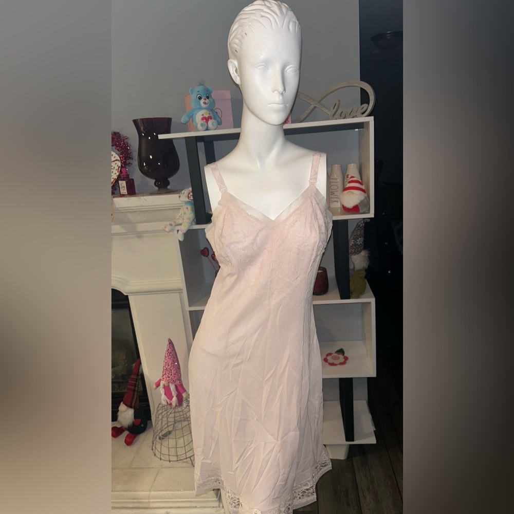 classic slip style with lace V neck and soft cup trim, fitted waist band.